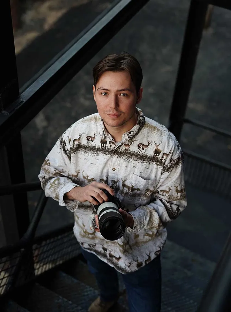 Tennyson Thomas holding a camera